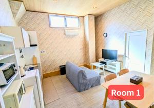 a living room with a room with a room sign at MORIHIRO Building in Ichikawa