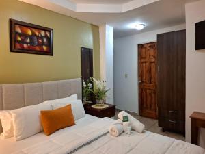 a living room with a white couch in a room at Hotel La Casa de la Abuela in Boquete