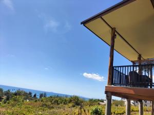 a porch of a house with a view of a mountain at Baan Seaview Sunset in Ko Lanta