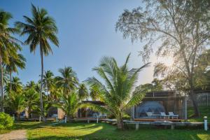 a house in a park with palm trees at Koh Sdach Resort by EHM in Kaoh Sdach
