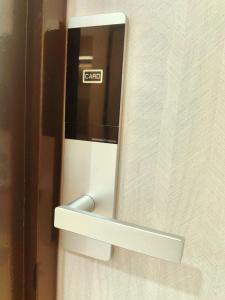 a glass door with the word cancel written on it at 118 Grand Hotel in George Town +52 photos