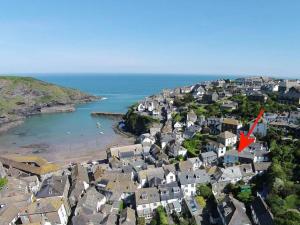 an aerial view of a town with a red arrow at Homelands in Port Isaac