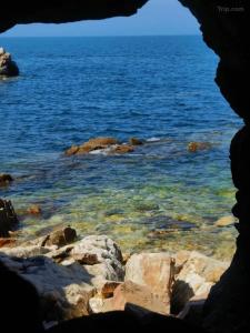 a view of the ocean through a rock window at JOYSEA HUT in Yantai +89 photos