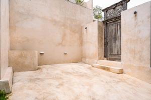 an empty courtyard of a building with a door at South Villa Ungasan in Ungasan +49 photos