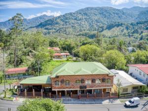 an overhead view of a building with a green roof at Hotel La Casa de la Abuela in Boquete