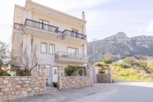 a villa with a view of the mountains at Afroditi's Delux apartment in Monemvasia