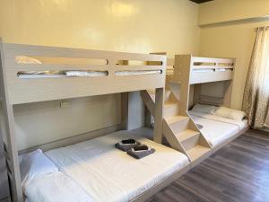 a room with two bunk beds in a room at Misty Hills in Baguio +187 photos