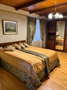 a bedroom with a large bed in a room at Charda Hotel in Uzhhorod +42 photos