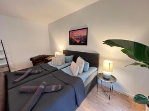 a bedroom with a bed with pillows on it at Villa Louis Hirsch in Gera