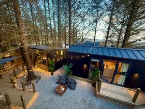 an aerial view of a tiny house in the woods at The Secret Garden Glamping Cornwall in Cury