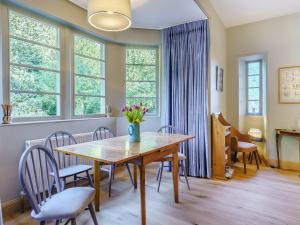 a dining room with a table and chairs at East Lodge in Falkland