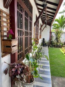 a porch of a house with plants on it at Cactus Piliyandala in Piliyandala