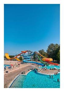 a water park with slides and people in the water at Apartma Zala in Brežice