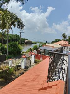 a walkway with a view of a river at Mansion Du Lac in Kottayam