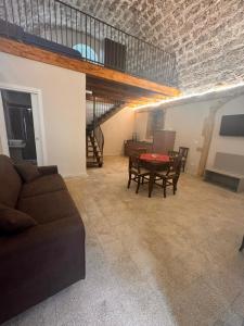 a living room with a couch and a table at Nonna Pia in Noto +21 photos