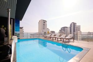a swimming pool on the roof of a building at The Sol Hotel in Nha Trang