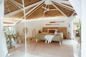 a bedroom with a bed in a room at Punta Punta Surf Retreat in General Luna