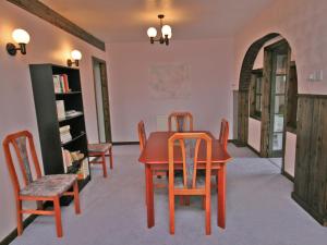 a dining room with a table and chairs at Ken Maree in South Erradale