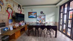 a dining room with a table and chairs at 清境77窩House-包棟包層民宿 in Ren'ai