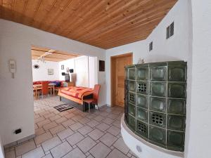 a bedroom with a bed and a living room at 2 Ferienwohnungen Klenk in Gruibingen