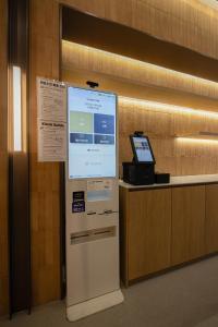 a large screen on a wall in a room at Haeundae Marine Capsule Hotel&Spa in Busan +57 photos