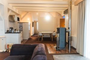 a living room with a couch and a table at Hotel Villa Will in Hannover