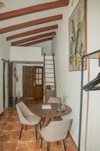 a dining room with a table and chairs at Cortijo el Sendero in Alora