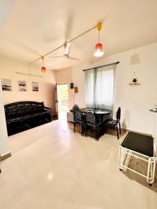 a large living room with a table and chairs at A La Mer - Azul 2 in Varca