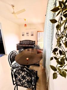 a dining room with a table and chairs at A La Mer - Azul 2 in Varca +5 photos