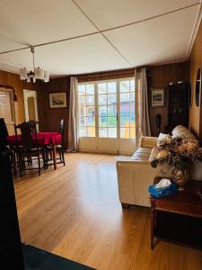 a living room with a couch and a table at Chill & Nature in Nargis