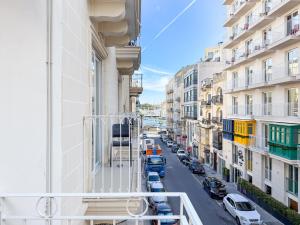 a view of a street from the balcony of a building at Island Guesthouse in Il-Gżira