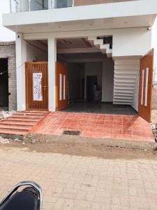 an empty building with a gate and a brick floor at Hotel Kanha palace in Lucknow