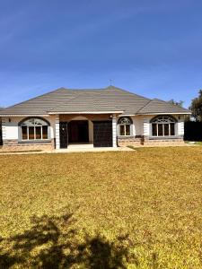 a house with a large yard in front of it at NAIBERi LUXURY HOME in Eldoret