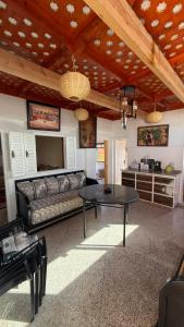 a living room with a couch and a table at Résidence chez Said in Sidi Ifni