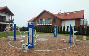 a playground in front of a building at Łebska Ostoja - Zacisze in Żarnowska