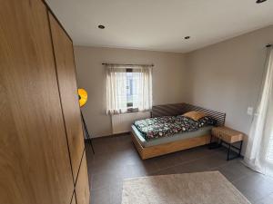 a bedroom with a bed and a window at stayOldenburg in Oldenburg