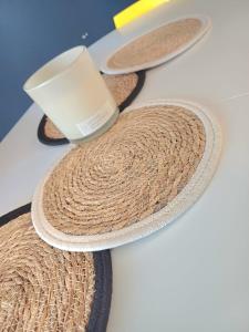 a straw hat with a cup on top of it at Le Loft - En Plein Centre Très Spacieux in Beauvais