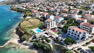 an aerial view of a town next to the ocean at Pool Apartment Galeb in Pag