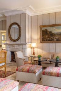 a living room with a couch and a fireplace at Hotel Lisboa Plaza - Lisbon Heritage Collection - Avenida in Lisbon +67 photos