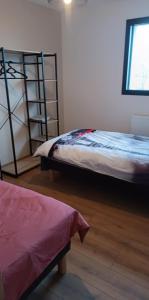 a bedroom with two bunk beds and a window at Gite du Châtelard in Thiébouhans