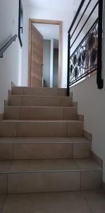 a set of stairs with a mirror and a door at Gite du Châtelard in Thiébouhans