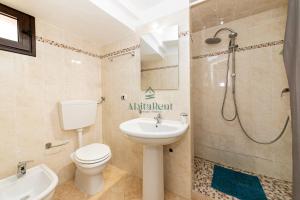a bathroom with a toilet and a sink and a shower at Casa di Ponente - Gallipoli in Gallipoli