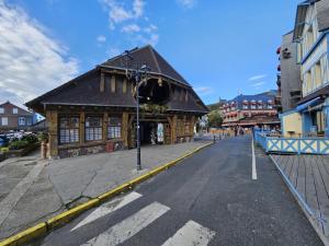 a building in the middle of a street at Étretat, Alphonse Karr in Étretat