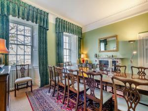 a dining room with a table and chairs at Ladywell House in Falkland
