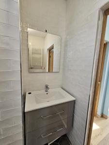 a bathroom with a sink and a mirror at Étretat, Alphonse Karr in Étretat