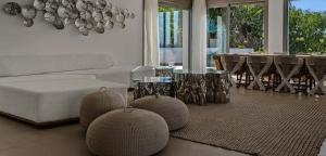 a living room with a couch and a table at Super views in Mykonos in Psarou