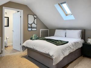 a bedroom with a large bed in a attic at Pasture Barn in Barnard Castle +10 photos