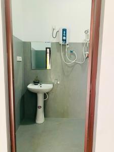 a bathroom with a sink and a mirror at AQUARIUS Stay in Tangalle +33 photos