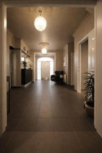 a hallway with a large tile floor in a building at Nupan Deluxe in Keflavík