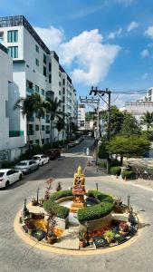 a view of a street with cars parked on the road at Oh'tel Kata in Kata Beach